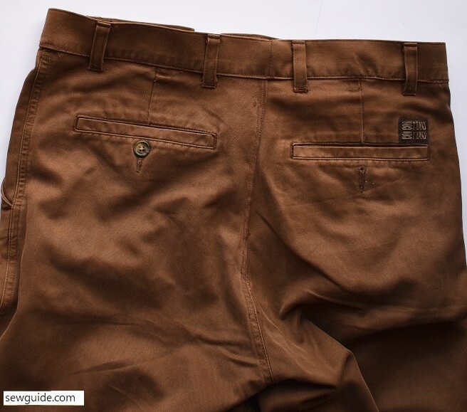 Join the waistband to the top edge of the pants