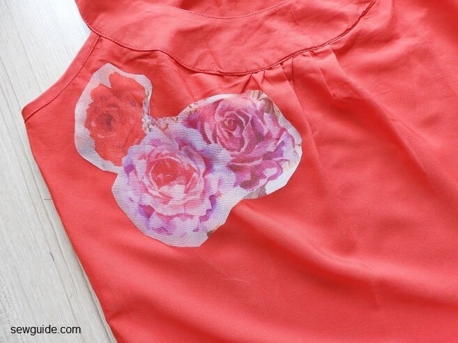 place the floral applique on clothing surface