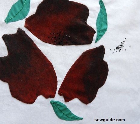 Adding beads to applique work