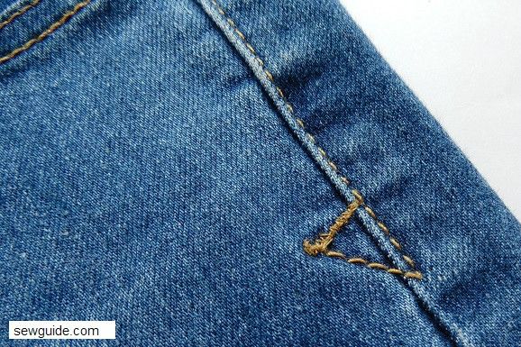 arrowhead stitch on denim jeans to reinforce the seam