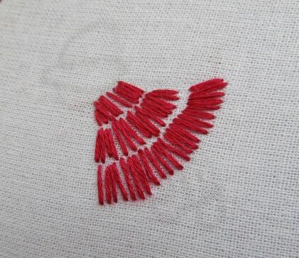 To embroider the sun bonnet sue make straight stitches to fill the dress