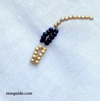 10 small beads taken on the beaded needle.