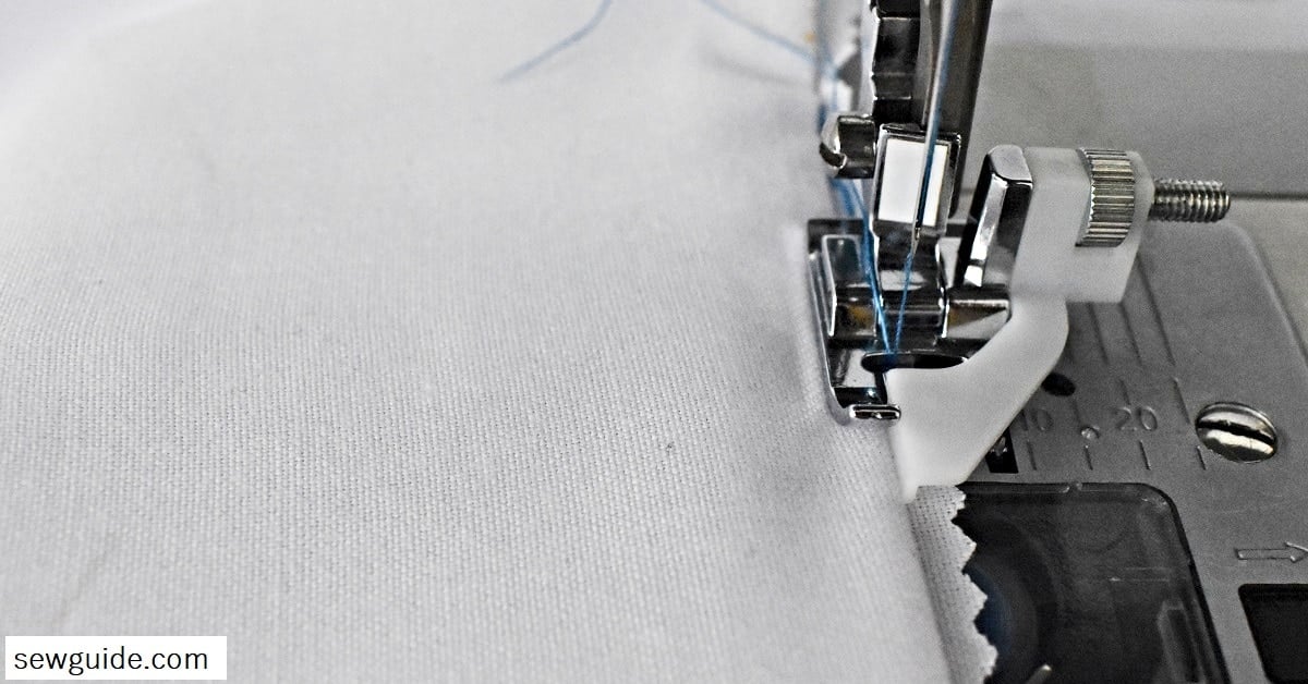 align the edge guide with the fold of the fabric