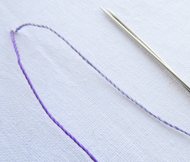 Use 2 threads and 2 needle - variegater thread