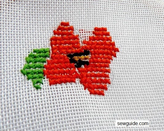 red color flower with cross stitch