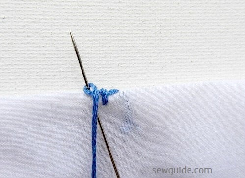 pull the needle and tighten the stitch; make more buttonhole stitches