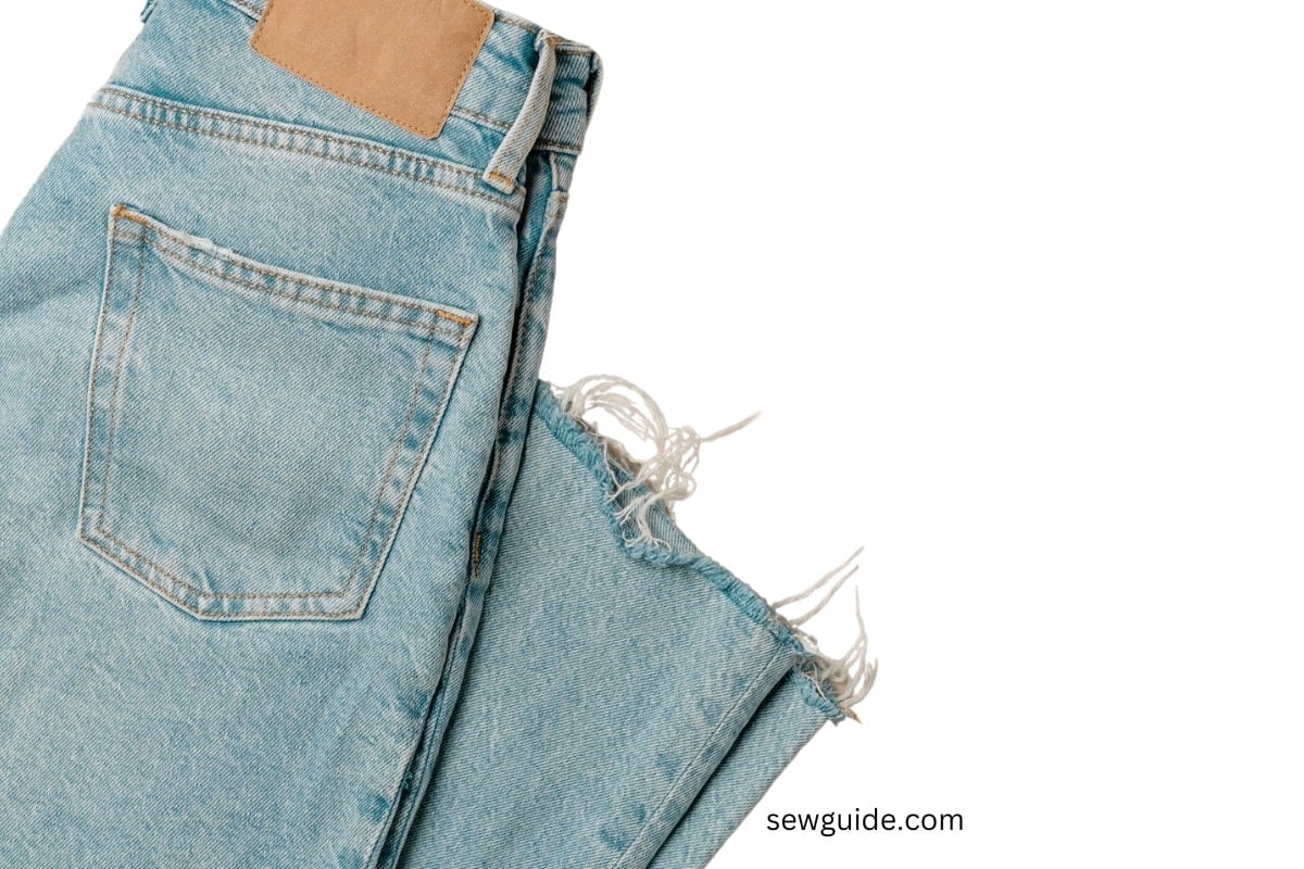 raw hem look of a light blue jeans