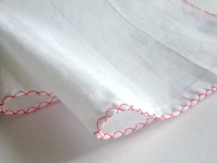 over cast edge stitching on an embroidered handkerchief diy