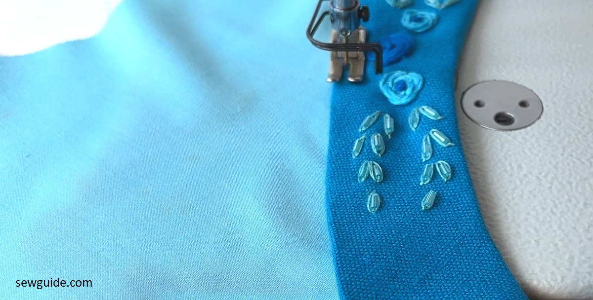 edge stitch the facing on the front of the neckline