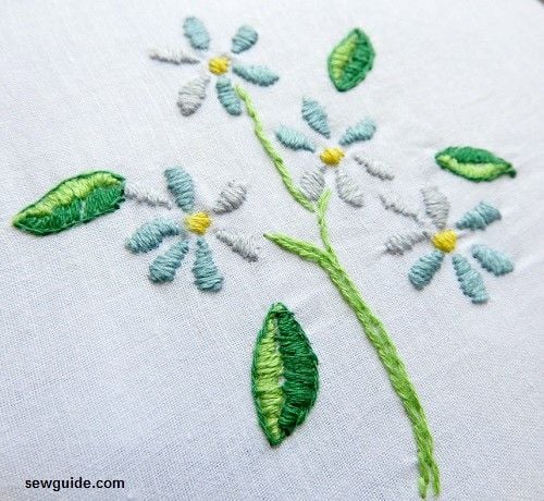 fill the 6 petal flowers with satin stitch; the leaves are also filled with satin stitch