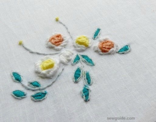 fill the circles with bullion stitches to make roses . Leaves outlinestitched and filled with satin stitches