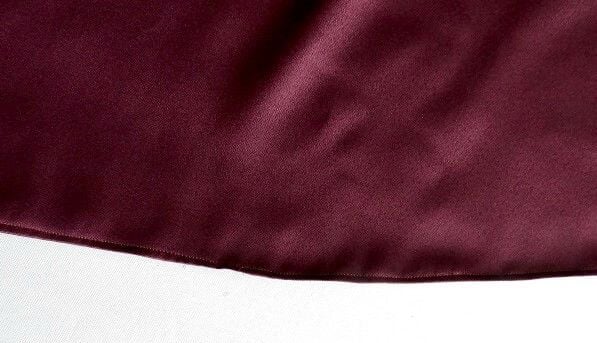 hem the bottom edges of the frilly sleeved drop shoulder top