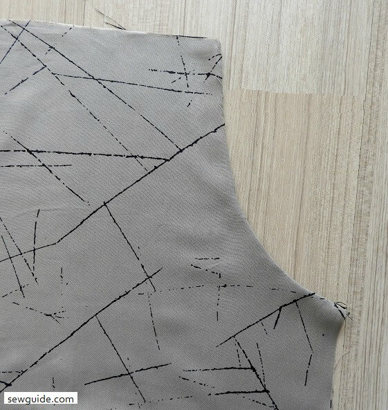 Press the pocket edges of the gathered skirt