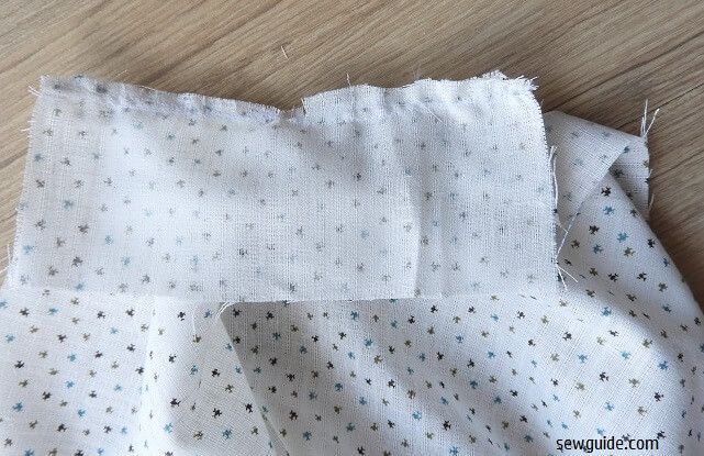 Sew the placket facing straight on the slit