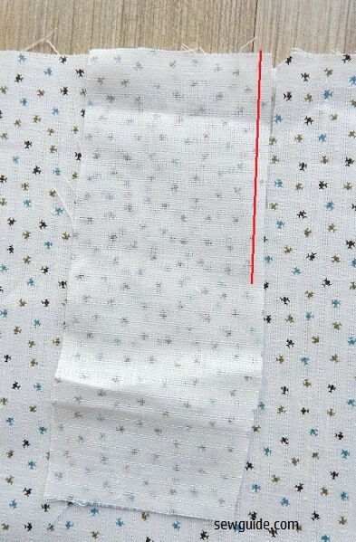 Keep the placket fabric on the slit