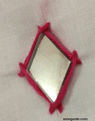 kutch work stitch around a mirror