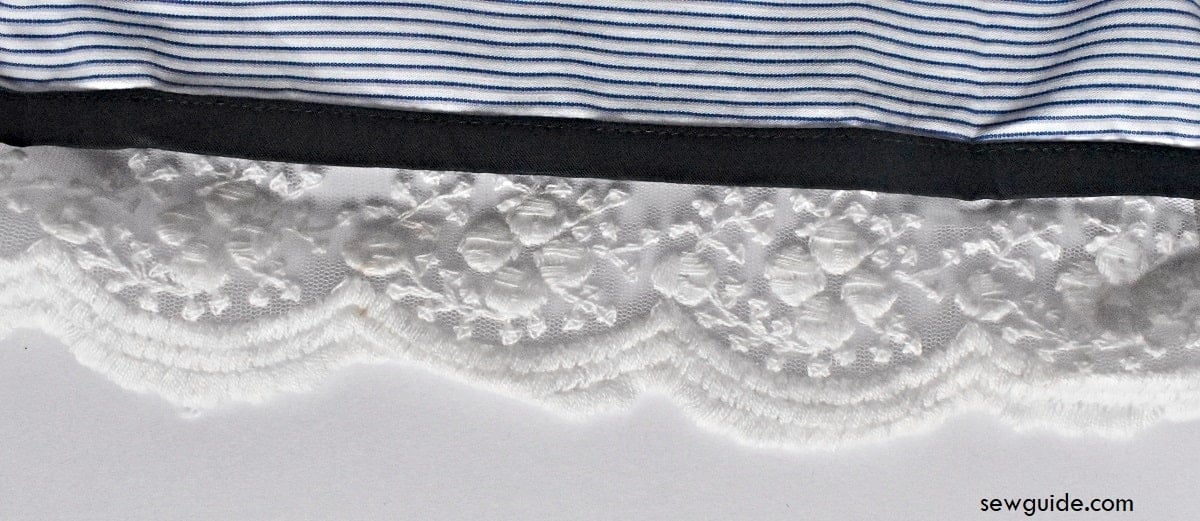 lace trim added with a piping like binded edge