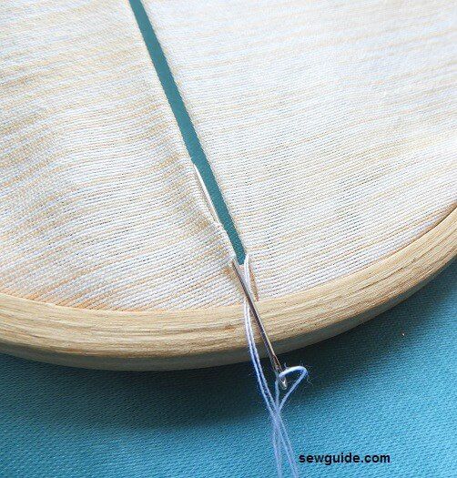 take one stitch from one side and then take a stitch along the fold on the other side