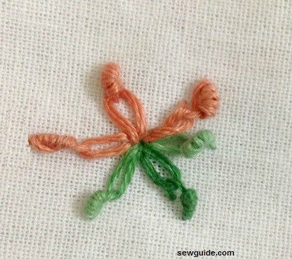 bullion knot stitch used to anchor the lazy daisy stitch