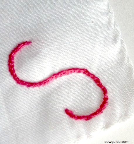Heavy braided chain stitch worked letter S