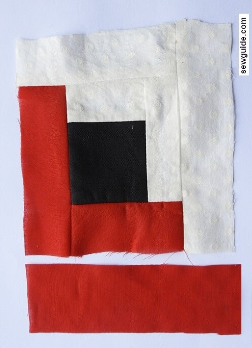 sew the red fabric strip to the bottom edge