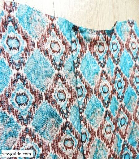 sew the top edge to fix the inverted pleat in place - this is how it looks on the back