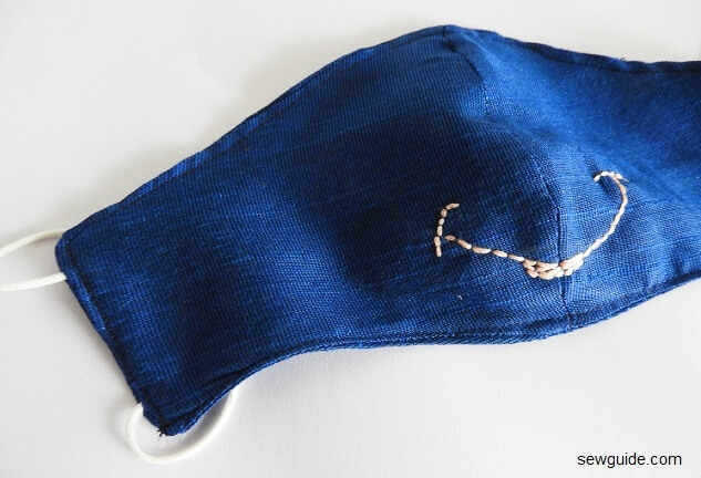 make embroidered designs of animal faces on kids masks