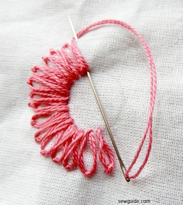 lazy daisy stitch made around the mirror design