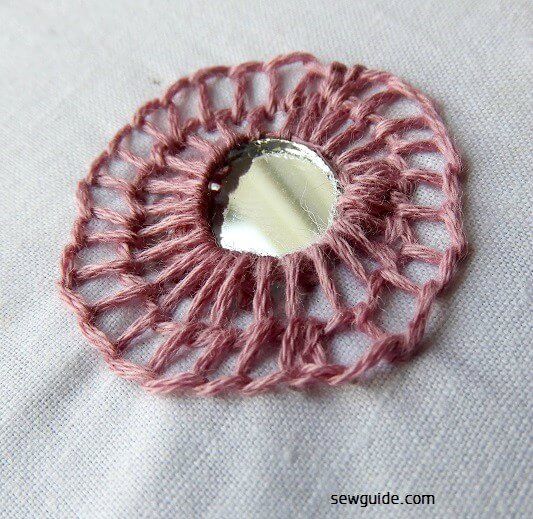 blanket stitches made around mirror