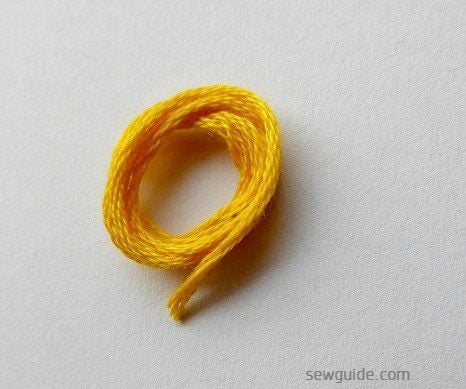 Embroidery floss is used to make a frame for mirrors