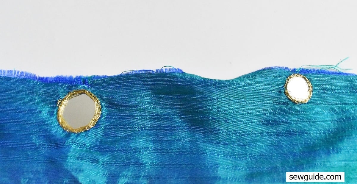 mirror attached with metallic thread