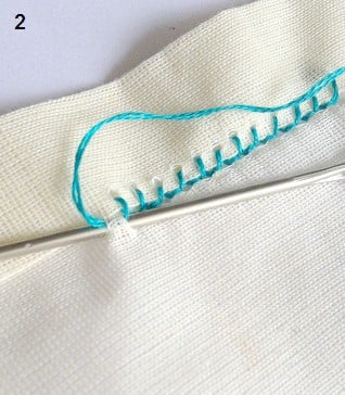 make blanket stitches in the hem with thread and big needle.