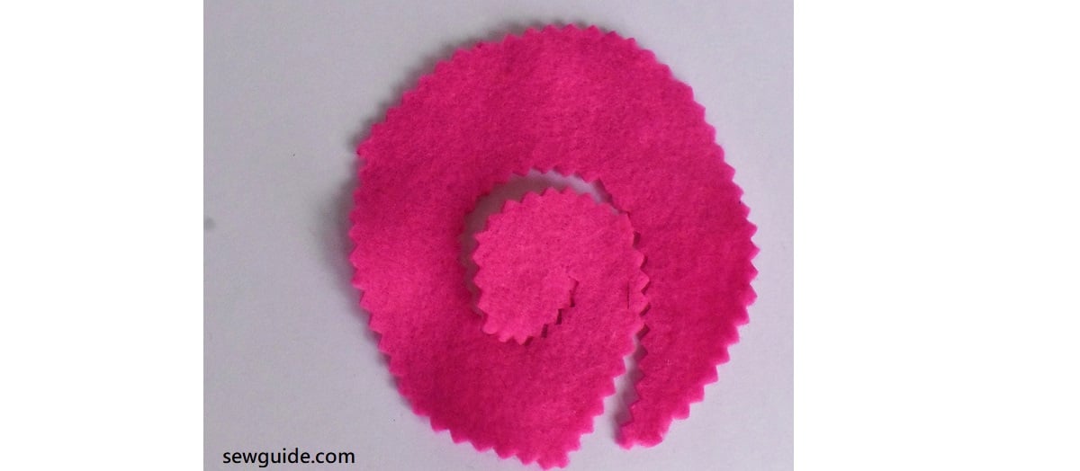 Cut in the shape of a twirl with the shears with zig zag edges