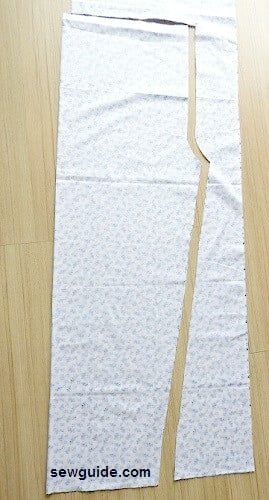 cut the pattern from the folded fabric for the pyjama pants