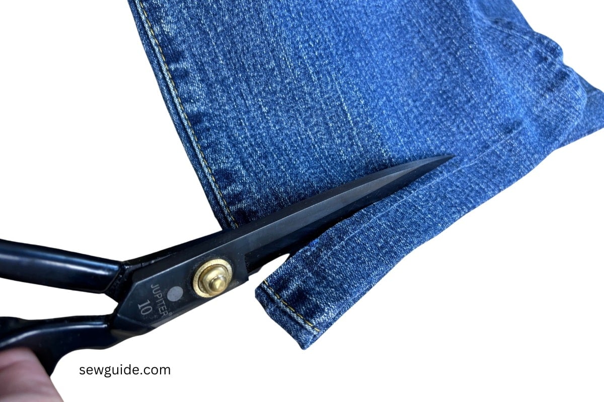 cutting off the hem of jeans