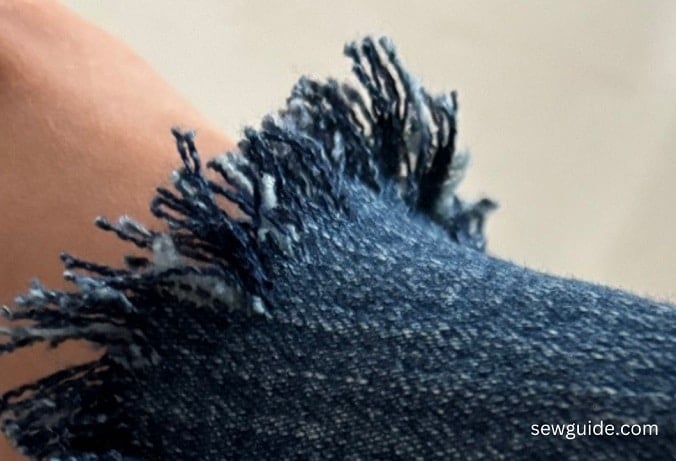 frayed edge of jeans