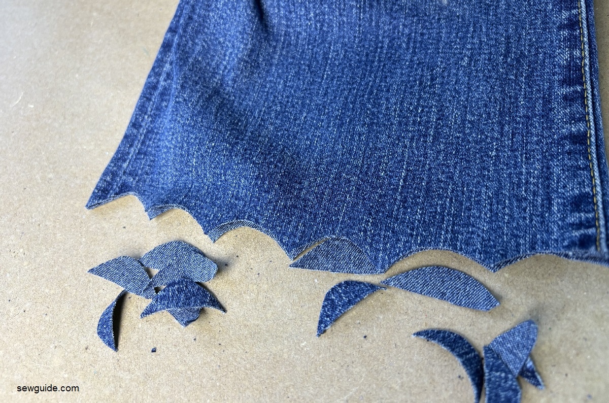 making curved shapes along the hem of jeans