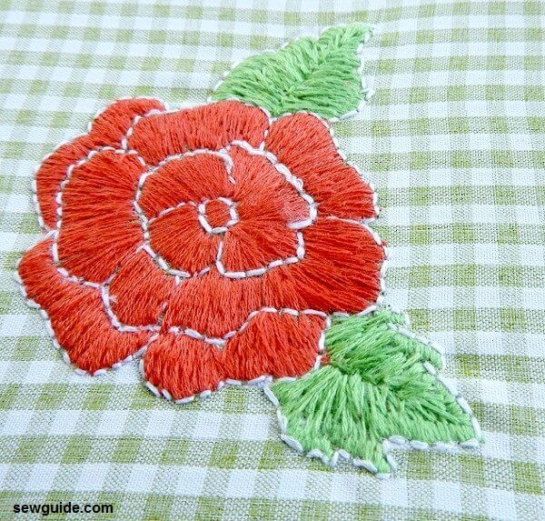 rose embroidery made on a chequered fabric