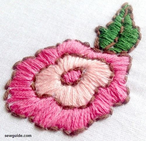 satin stitches filling the rose design 