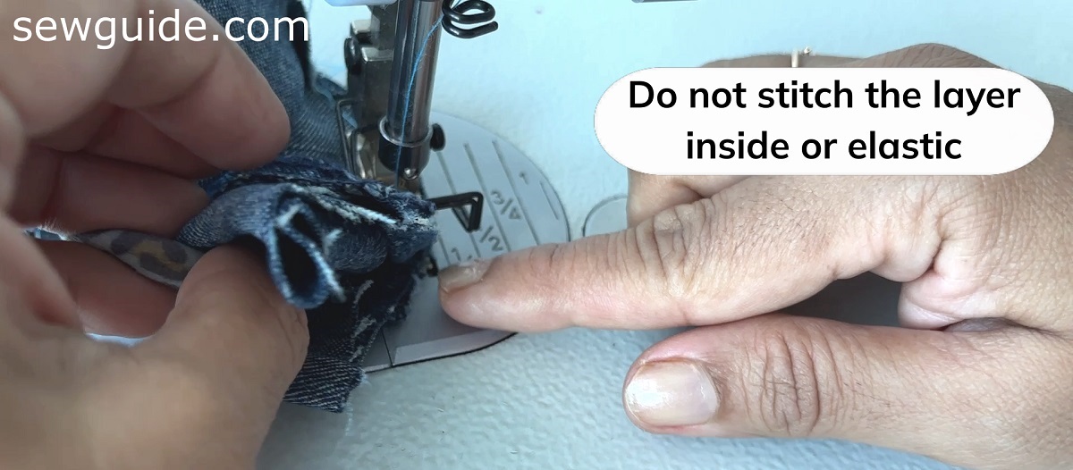 stitch the tube over the hair tie