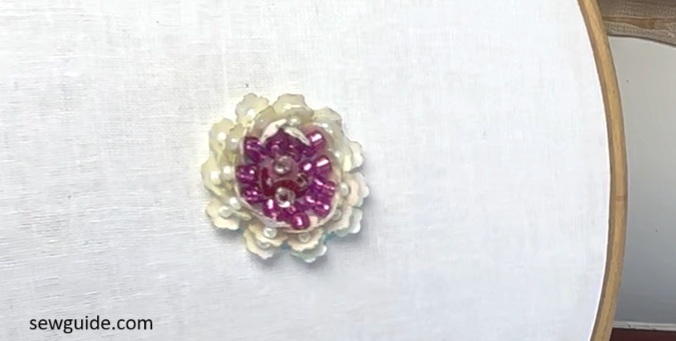 white sequins flower with pink seed beads