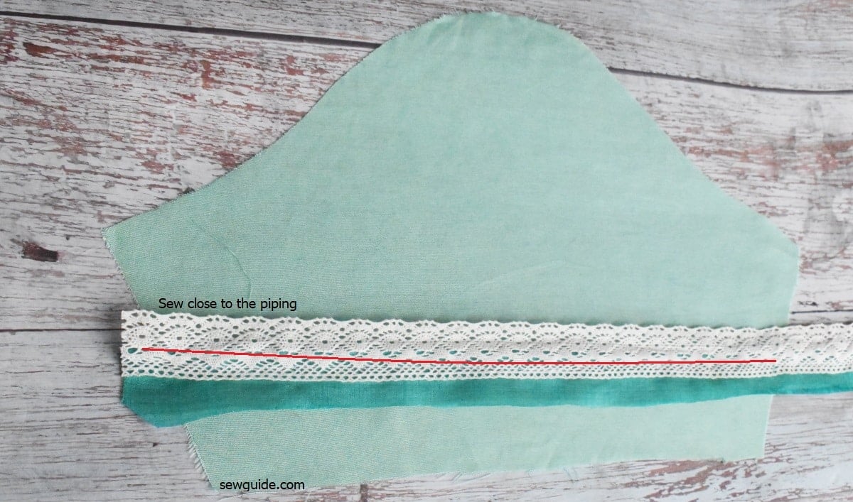 sew the lace edge close to the piping