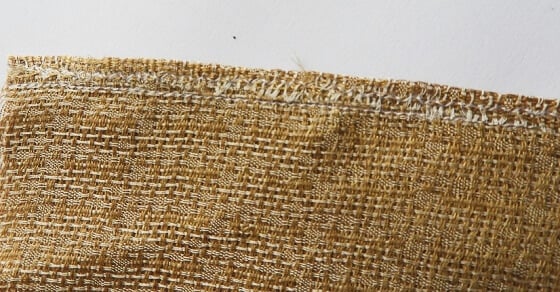 Turn the other seam allowance over the trimmed seam allowance and stitch in place