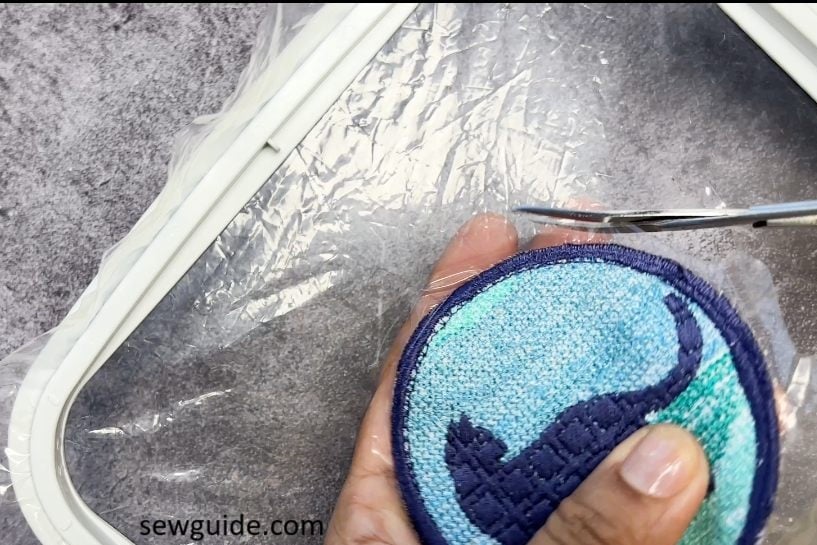 Cut out the patch from the plastic sheet