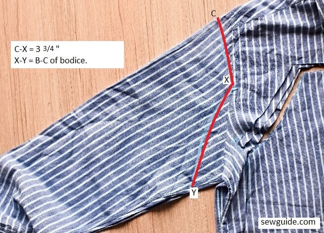 Cut out the sleeves of the top from the sleeves of the old shirt