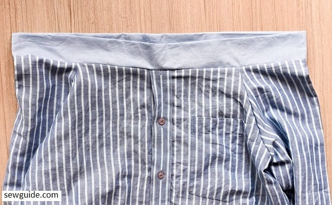 The top casing is sewn to the shirt edge for making a shirt from an old shirt