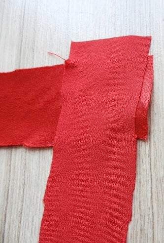 Join bias tape to make enough for the straps and bining the armhole