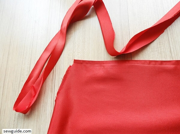 Use bias tape to bind the armhole 
