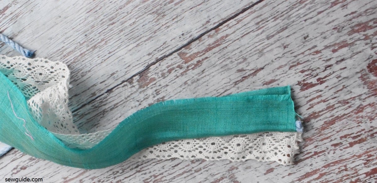 lace sewn to piping trim