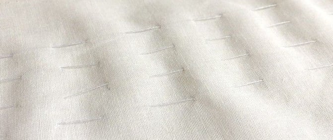 Make running stitches along the marks